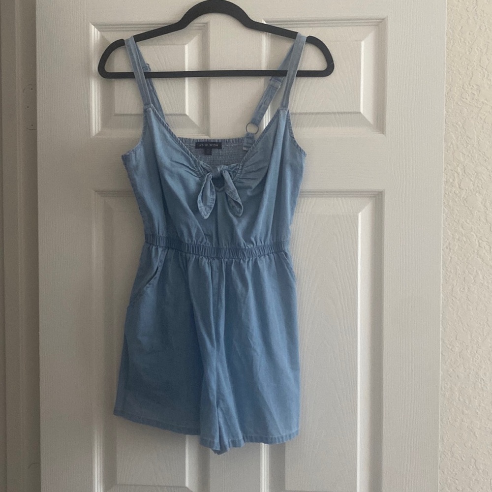 Denim romper with adjustable straps. Size XS. Great condition. Worn once.